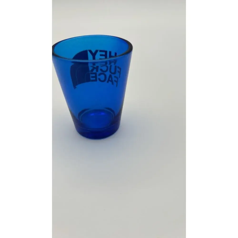 Hey F*** Face Shot Glass. Looks Like North face Logo. VG Condition.